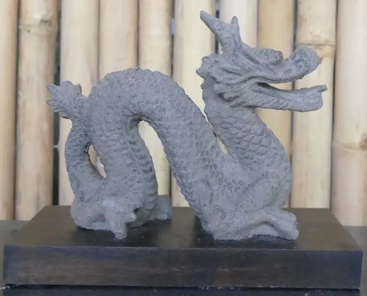 Product image 1 of the product “Reclining dragon, on a wooden base, approx. 16 cm. antique finish, cast lava stone ”